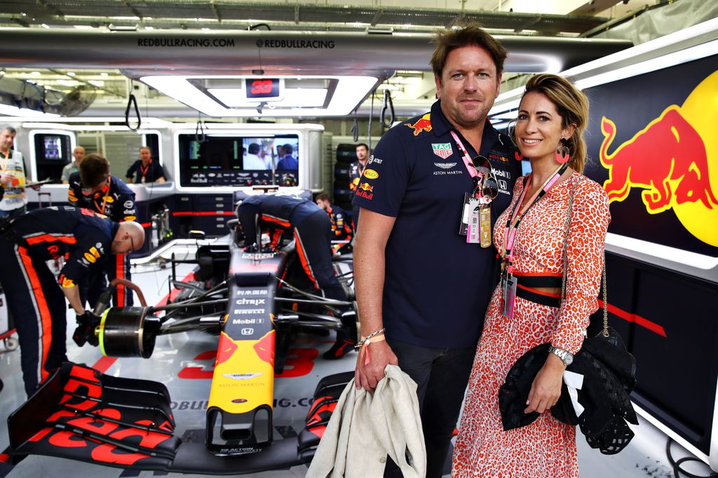 James Martin and Louise Davies with a Red Bull F1 car behind them