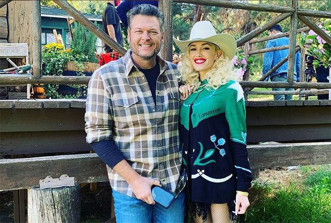 Blake Shelton in plaid shirt with Gwen Stefani in cowboy hat