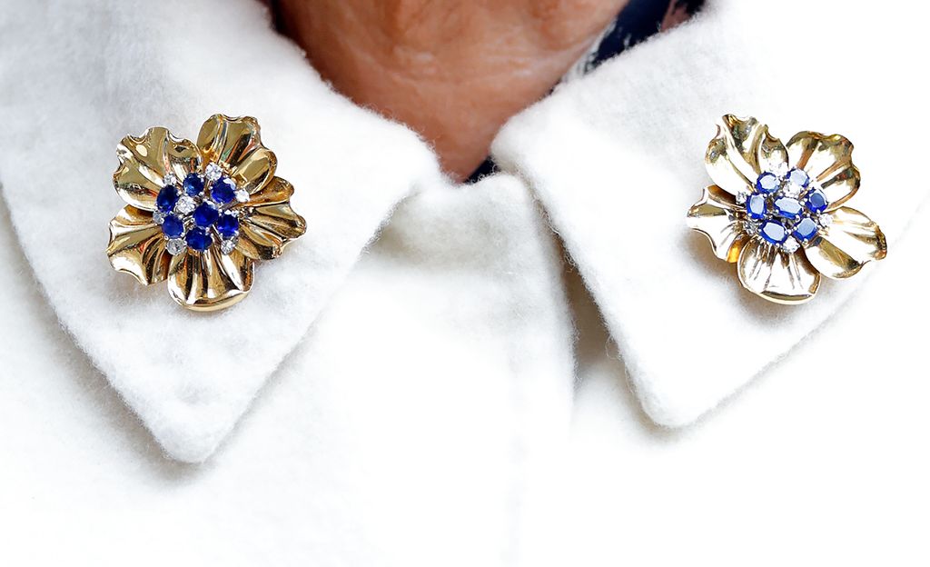 A close up of the late Queen's Cartier brooches