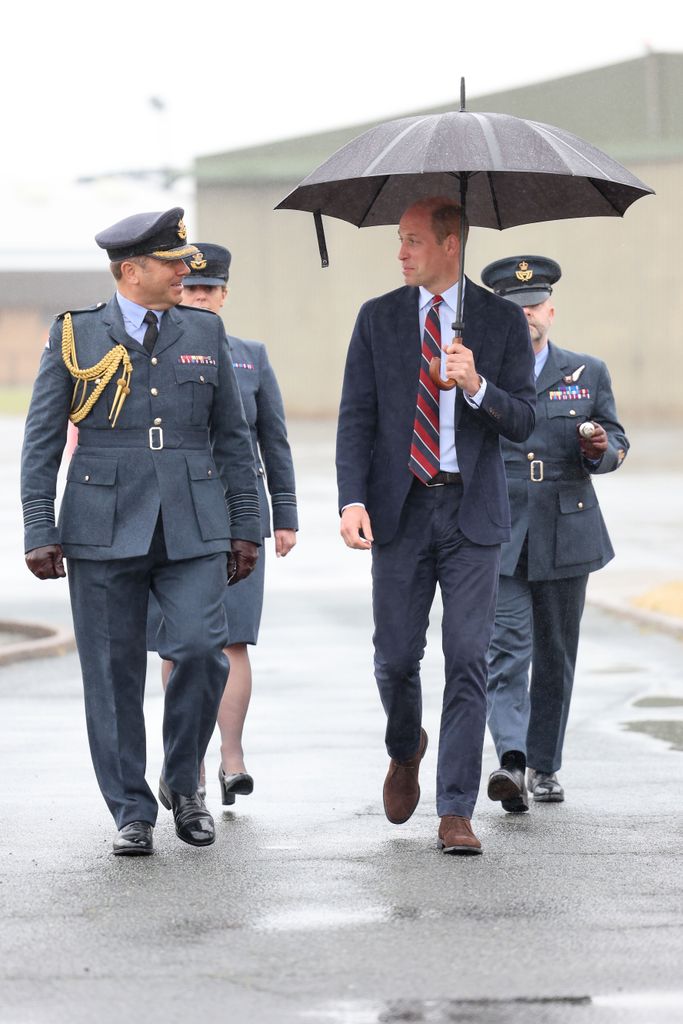 prince william smiling and laughing in rain