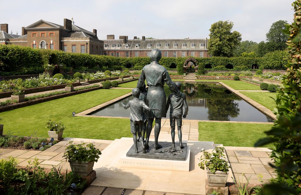 A statue of Diana, Princess of Wales along with her sons William and Harry in the sunken garden at Kensington Palace 