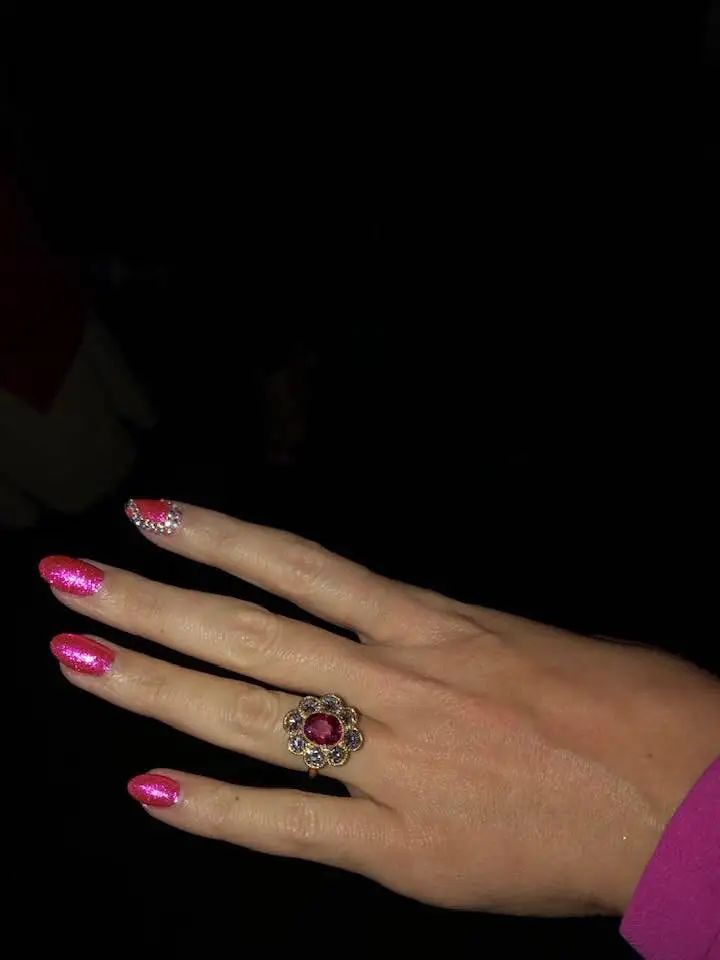 Katy's ring features a large pink stone on her hand