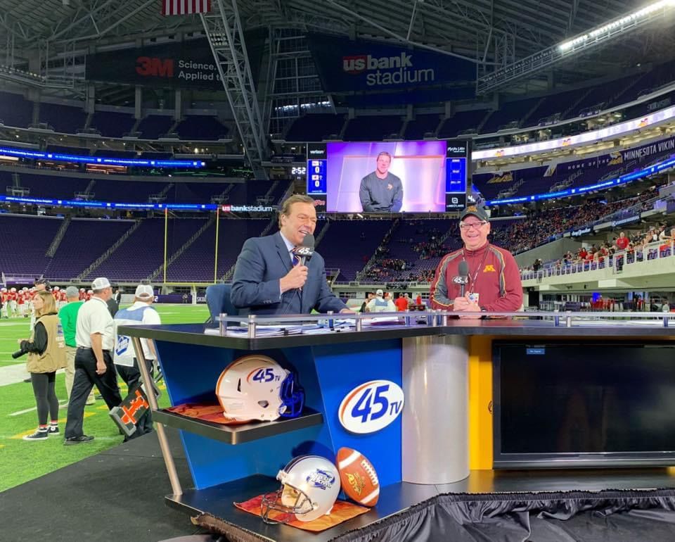 Photo shared by Tim Walz on Facebook of him commentating during a football game