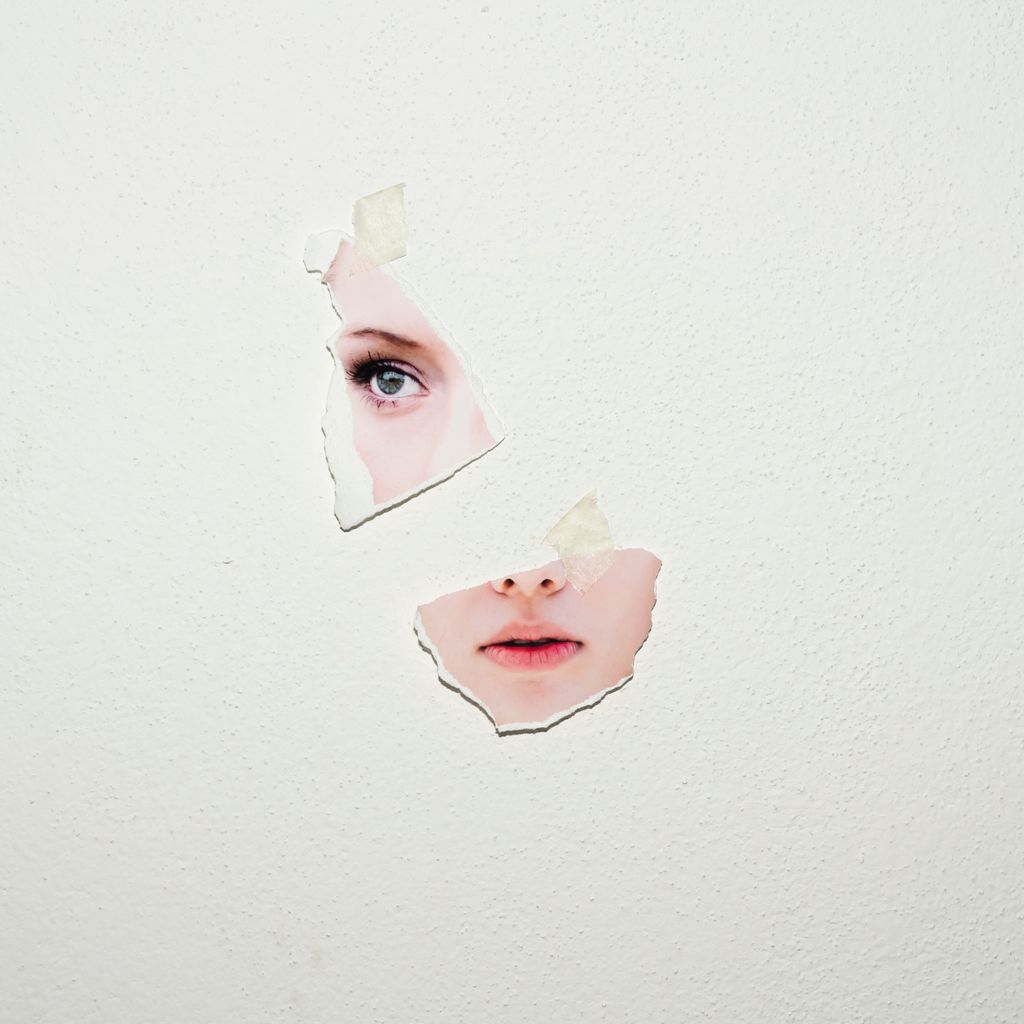 Conceptual woman portraiture. Pieces of print photos of different women put together to create a new identity.