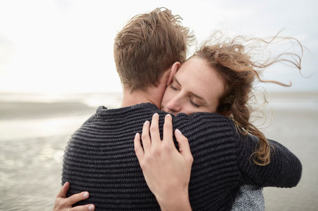 Couple hugging on the beach