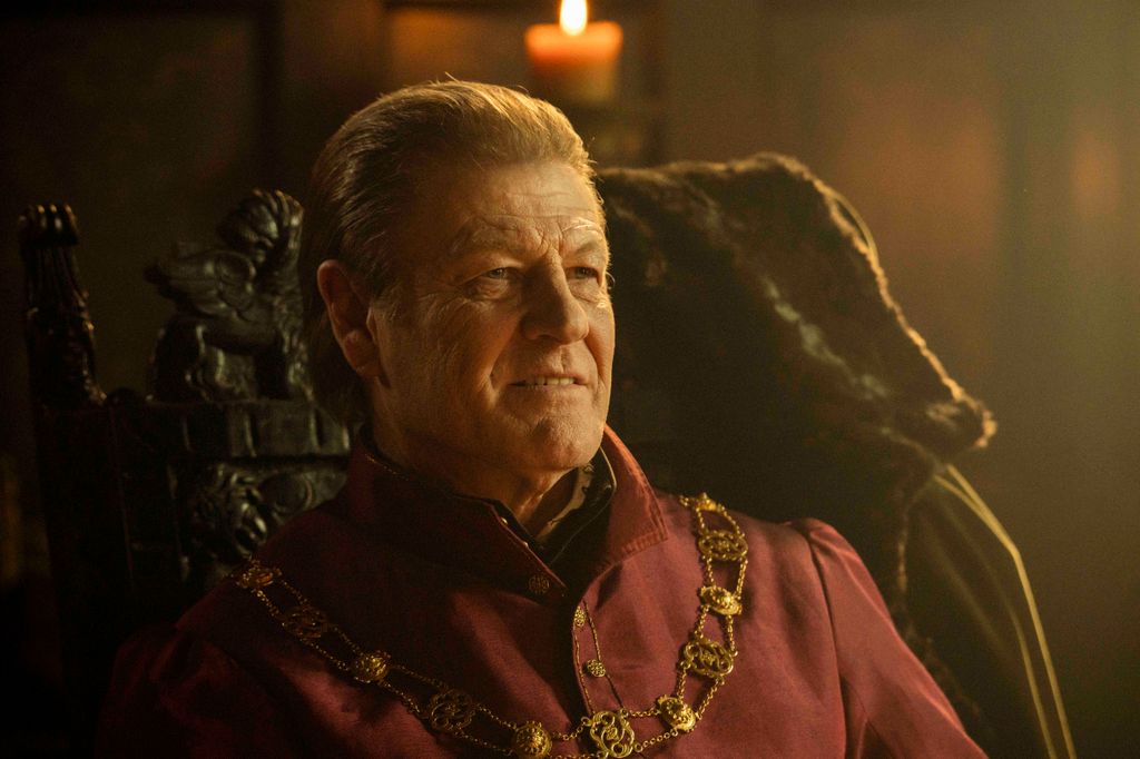 man sitting on throne