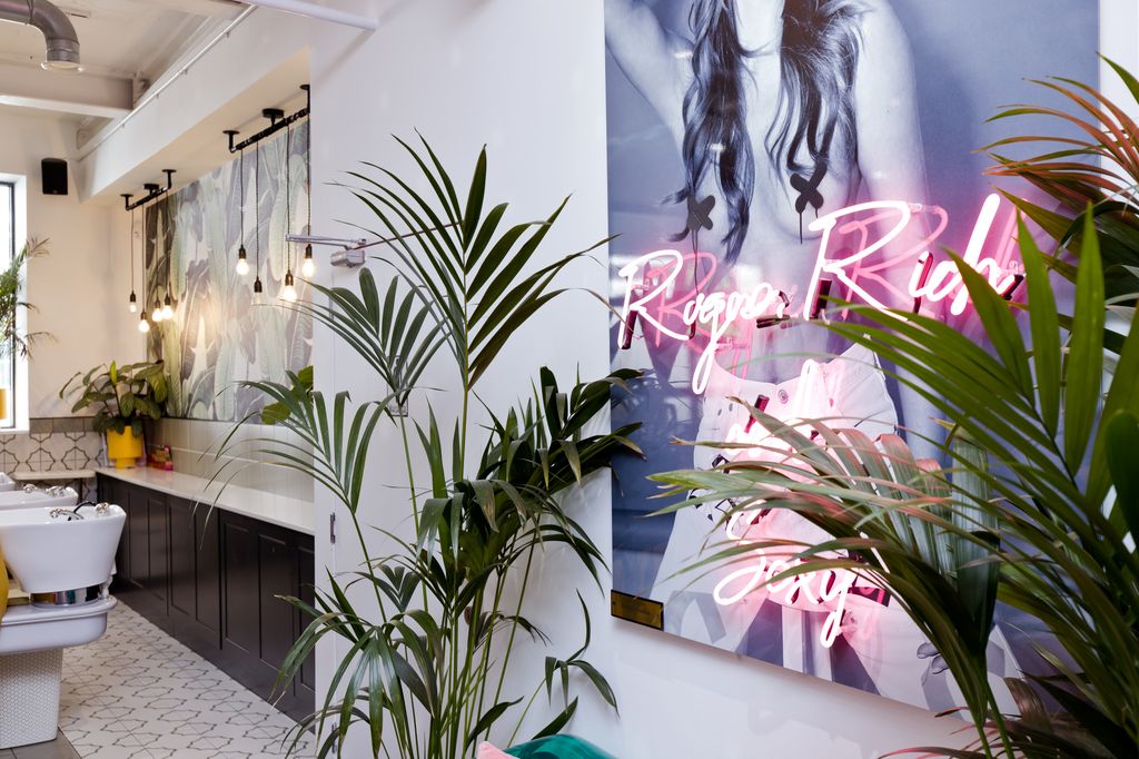 Beauty Collective London interiors with neon lights and sinks