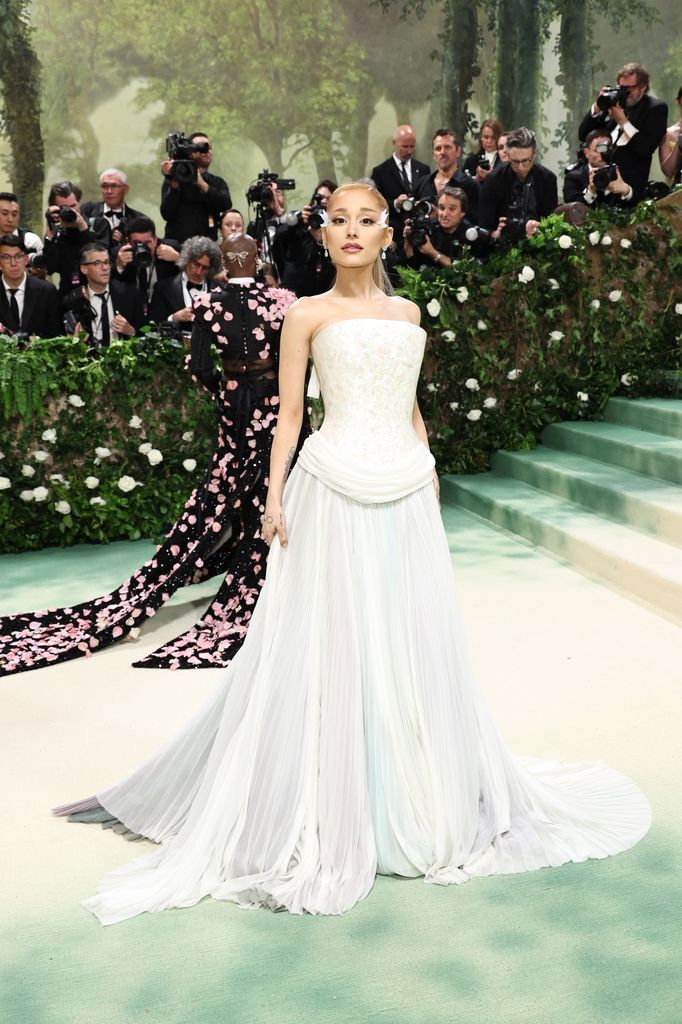Ariana Grande in a flowing white gown at the met gala