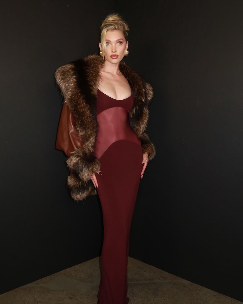 Elsa stunned in a burgundy maxi dress