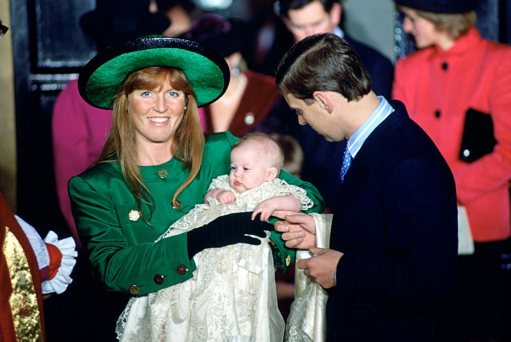 Sarah Ferguson hold a baby Princess Beatrice at a christening