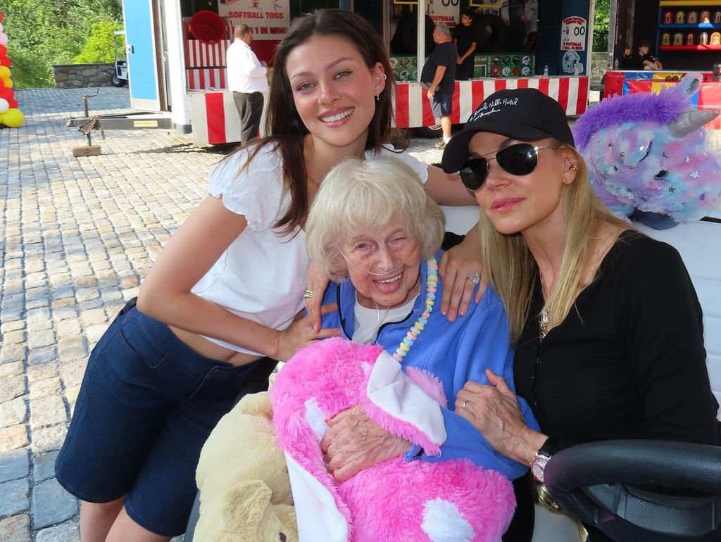 Nicola Peltz wearing dark denim shorts to celebrate her grandmother's 95th birthday 