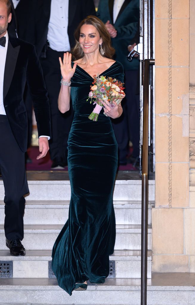 Kate Middleton wearing a velvet green dress
