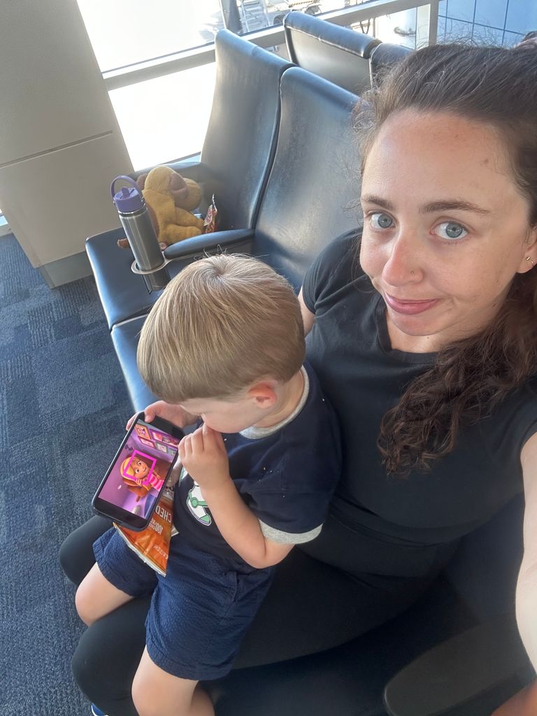 Charlie sitting on my lap at the airport