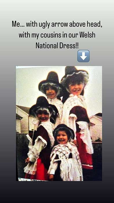 Catherines throwback photo of her standing with her back to her three cousins, all are wearing traditional Welsh dress