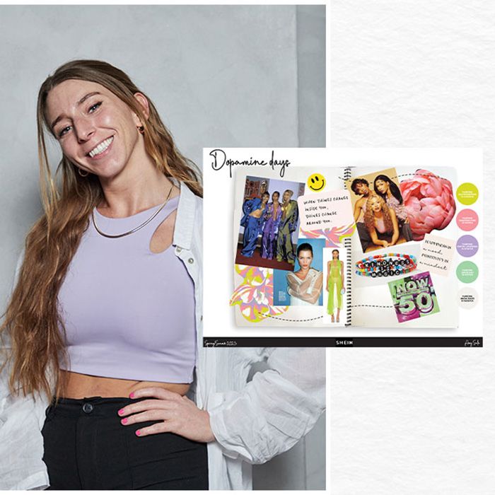 Amy Sala, the winner of the competition posing next to her moodboard