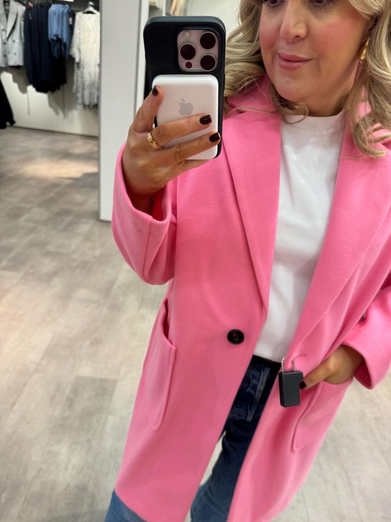 Leanne Bayley wearing a pink coat with pockets