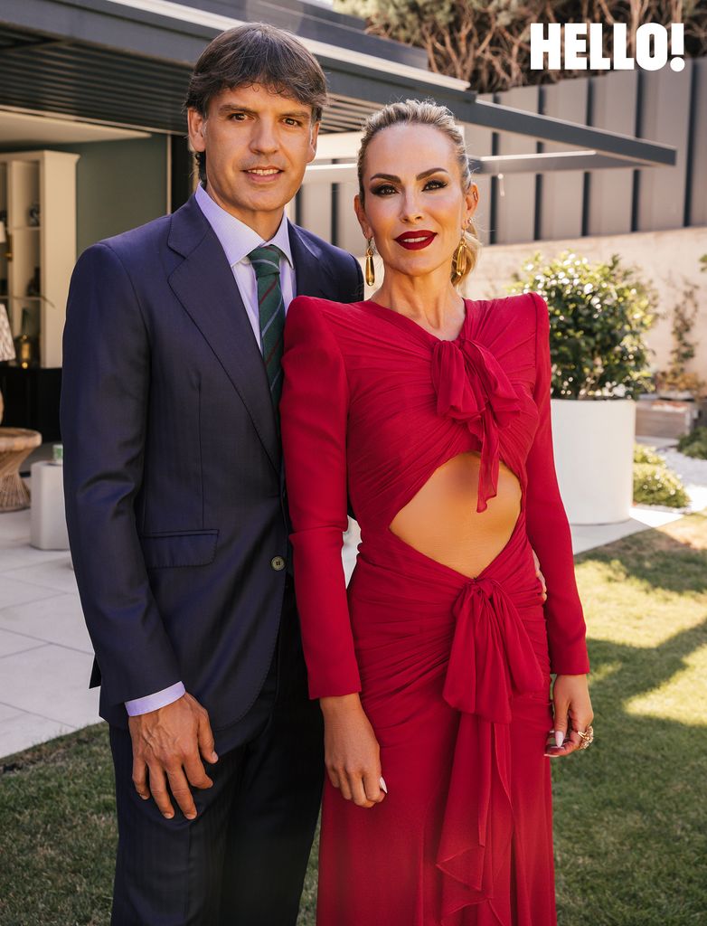 Fernando and Victoria outside their three-storey, contemporary-style house
