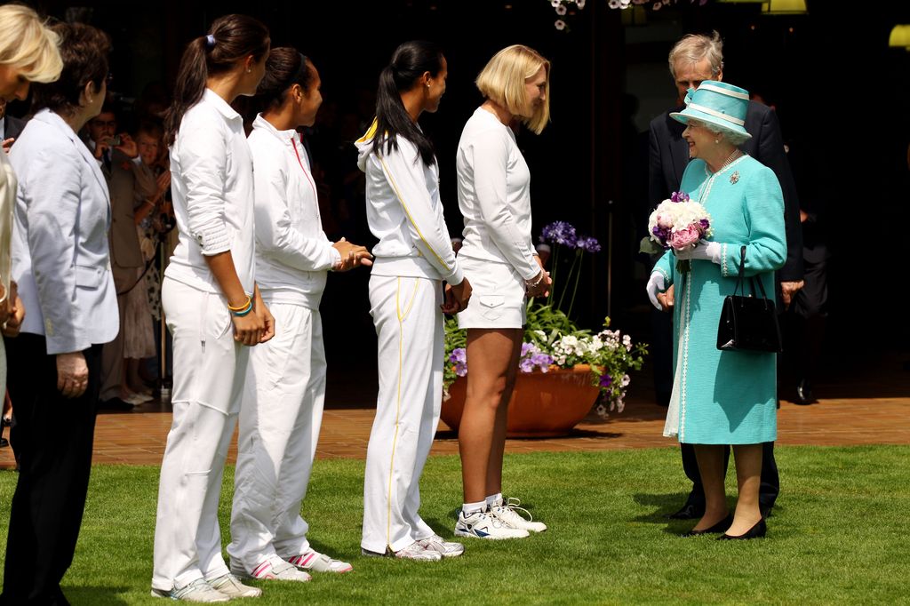 Queen Elizabeth in turquoise coat at Wimbledon 2010