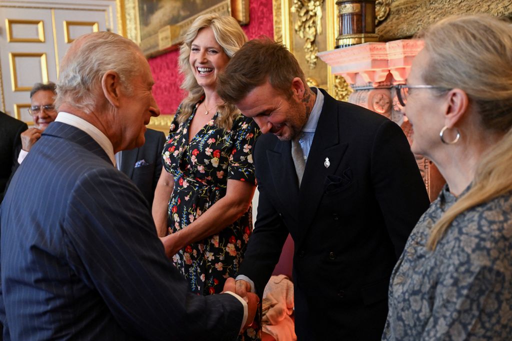 Britain's King Charles shakes hands with David Beckham next to Penny Lancaster and Meryl Streep, as they attend the King's Foundation Awards ceremony, on the 35th anniversary of The King's Foundation, at St James's Palace on June 12, 2025 in London, England.