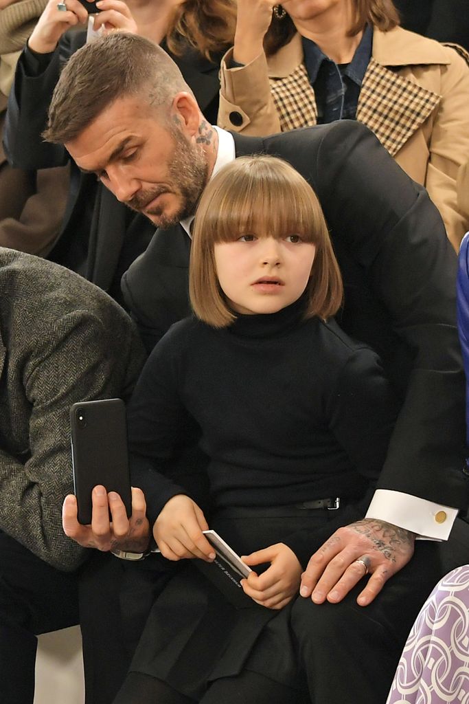 Harper sat with David Beckham in matching black outfits. She wore a turtleneck and sported a sleek bob, showcasing minimalist fashion that was chic and age-appropriate.