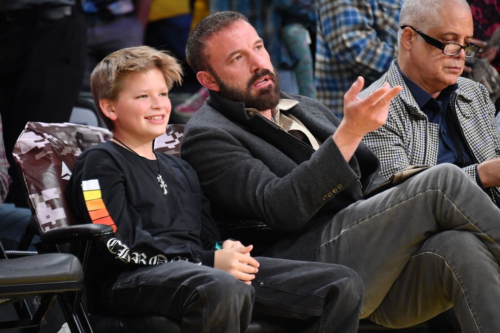 Ben Affleck (R) and his son Samuel attend a basketball game between the Los Angeles Lakers and the Toronto Raptors