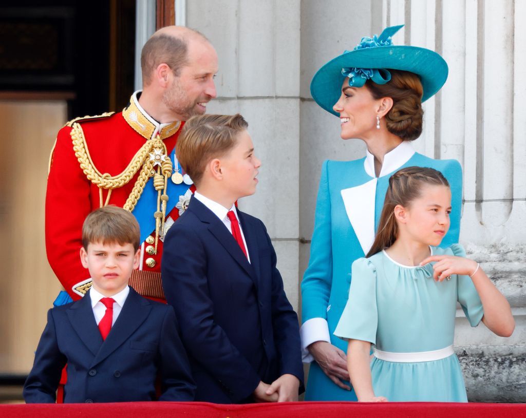 Prince William, Prince Louis, Prince George, the Princess of Wales and Princess Charlotte watch an RAF flypast from the balcony of Buckingham Palace