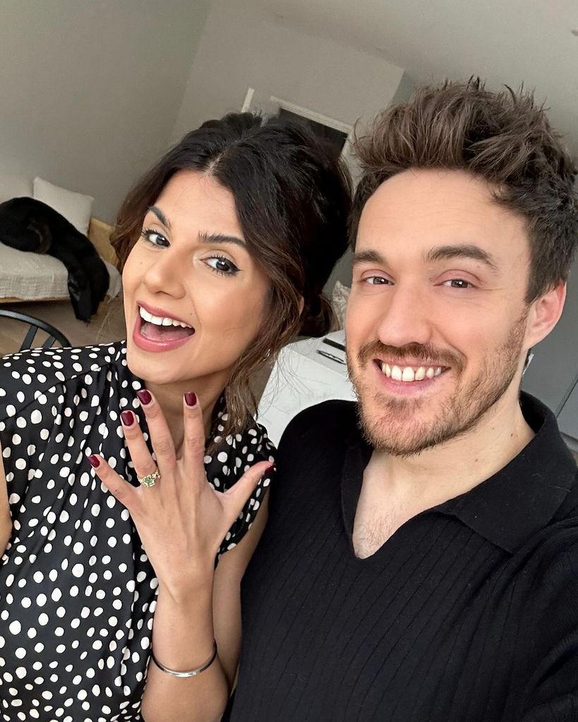 Ruby Bhagol holding up her engagement ring with her fiance James