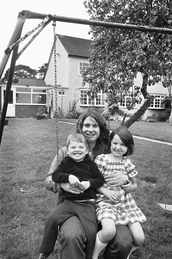 Ozzy Osbourne, singer with the Heavy Metal band Black Sabbath, seen here at home with his children Jessica and Louis, 19th August 1978 