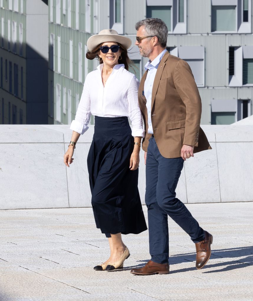 Mary and Frederik hold hands on Oslo Harbour