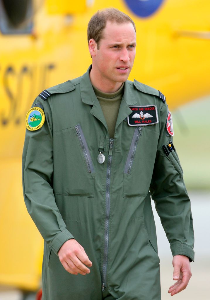 Prince William disembarks his RAF Search and Rescue Sea King Helicopter after giving his father Prince Charles, Prince of Wales a tour at RAF Valley on July 9, 2012 