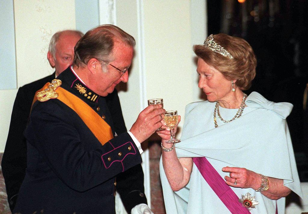 Princess Josephine-Charlotte clinking glasses with King Albert