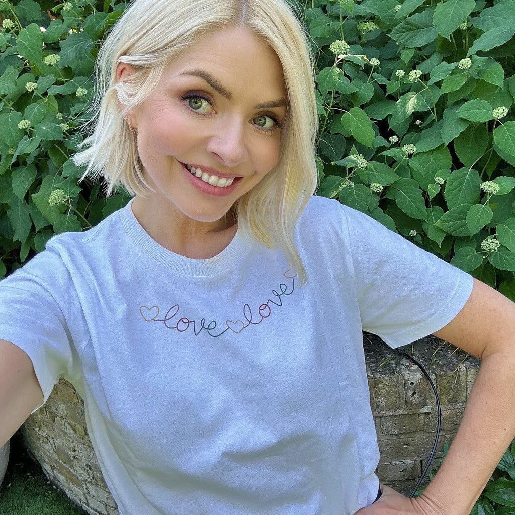 Holly Willoughby wearing white Young Lives vs Cancer charity tshirt in garden