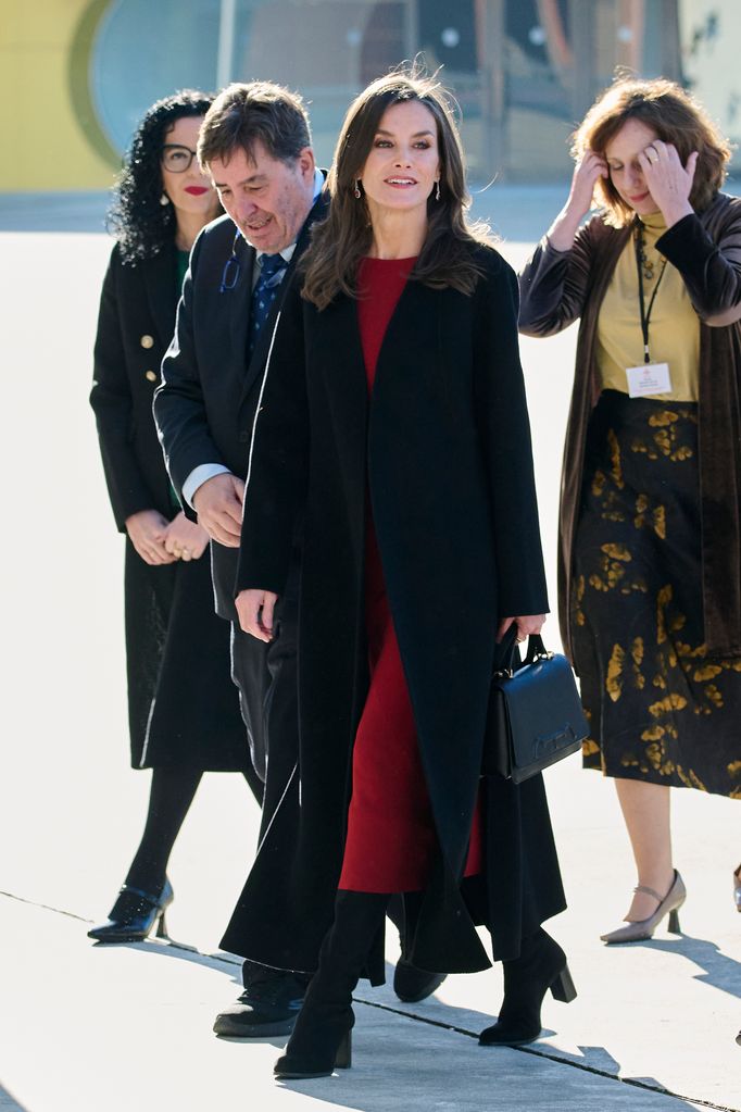Letizia in a longline coat and red dress