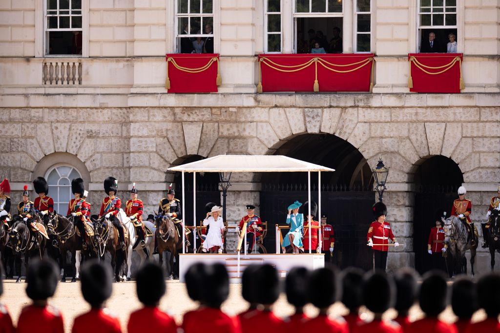 Members of the extended family watched the parade