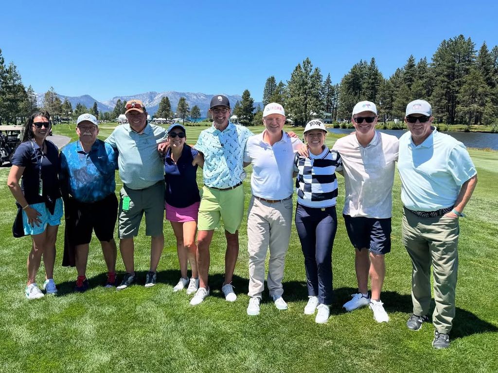 Dylan Dreyer, Brian Fichera and others pose for a photo on the green at the 2025 ACC Golf Championship, shared on Instagram