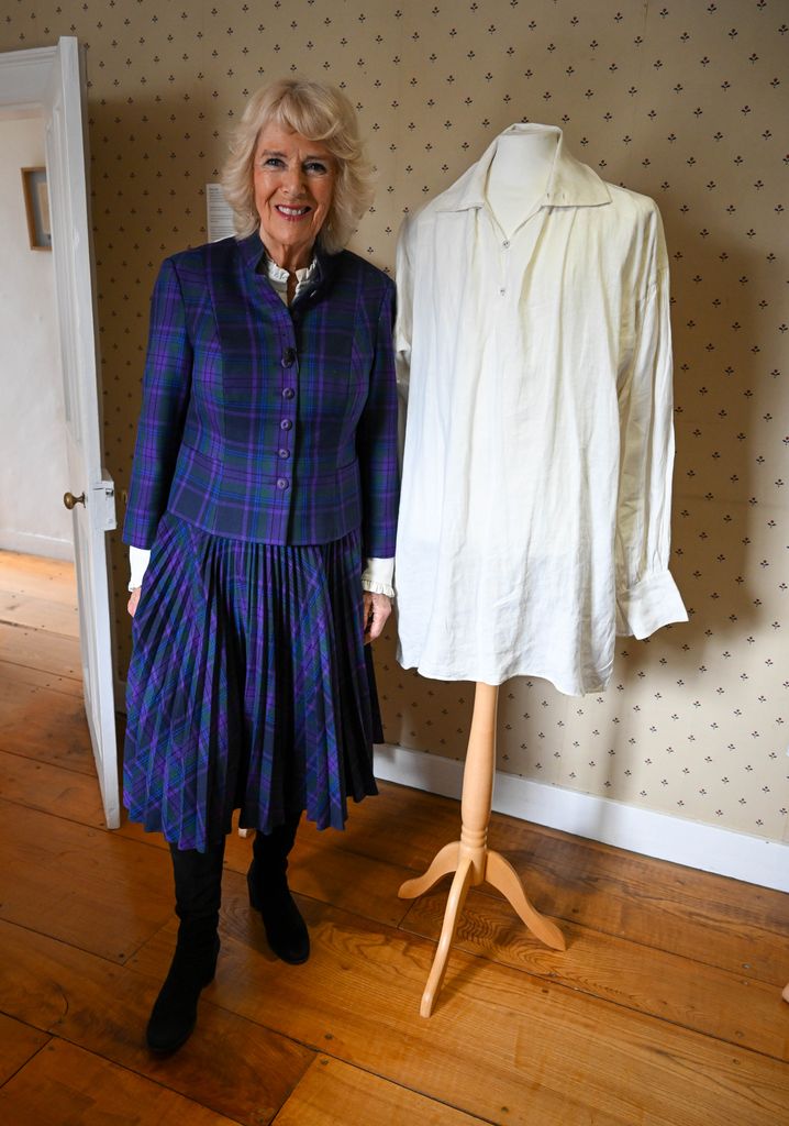 Queen Camilla posed with the shirt in 2022 at the museum inside Jane Austen's house