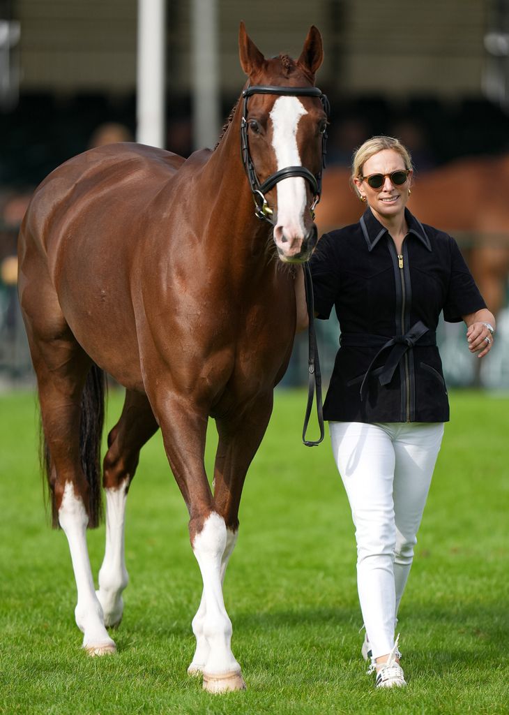 Zara Tindall in white jeans with her horse Class Affair