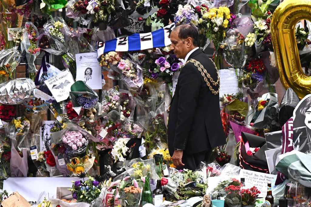 BIRMINGHAM, ENGLAND - JULY 30: Lord Mayor of Birmingham, Councillor Zafar Iqbal views the tributes prior to Ozzy Osbourne's funeral cortege traveling through his home city of Birmingham on July 30, 2025 in Birmingham, England. The Black Sabbath frontman passed away on July 22nd at the age of 76. His death occurred just a little over two weeks after his final live performance at the 'Back to the Beginning' concert in his hometown of Birmingham. (Photo by Leon Neal/Getty Images)