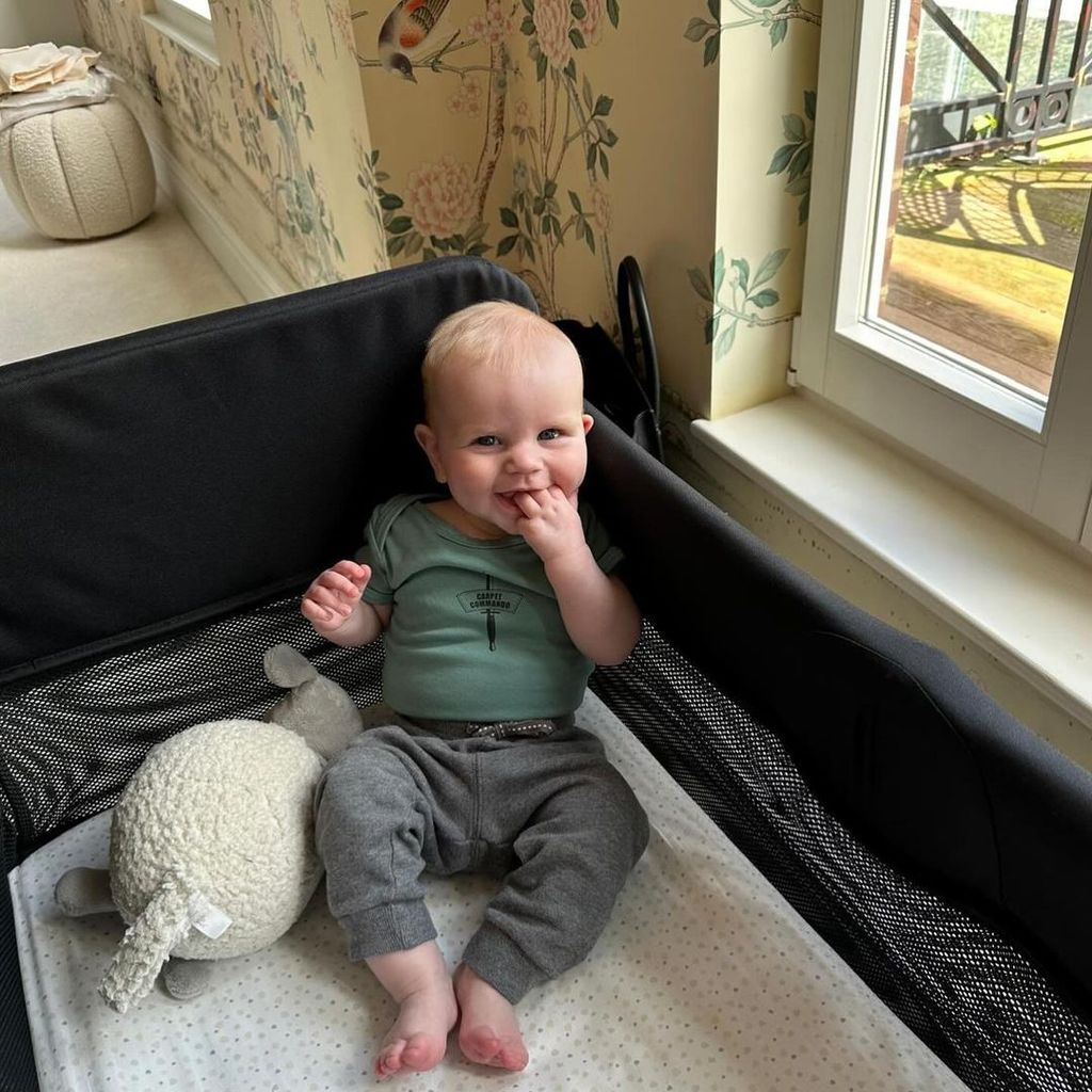 Gordon Ramsay's son Jesse smiling in his cot