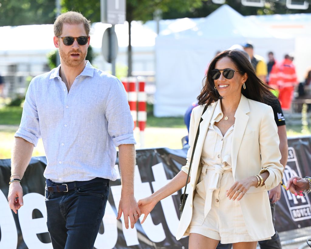 Prince Harry, Duke of Sussex and Meghan, Duchess of Sussex attend the cycling medal ceremony at the Cycling Track during day six of the Invictus Games 
