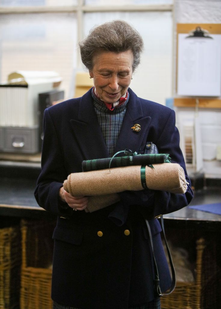 Princess Anne inspects cashmere and mohair fabrics at textile mill