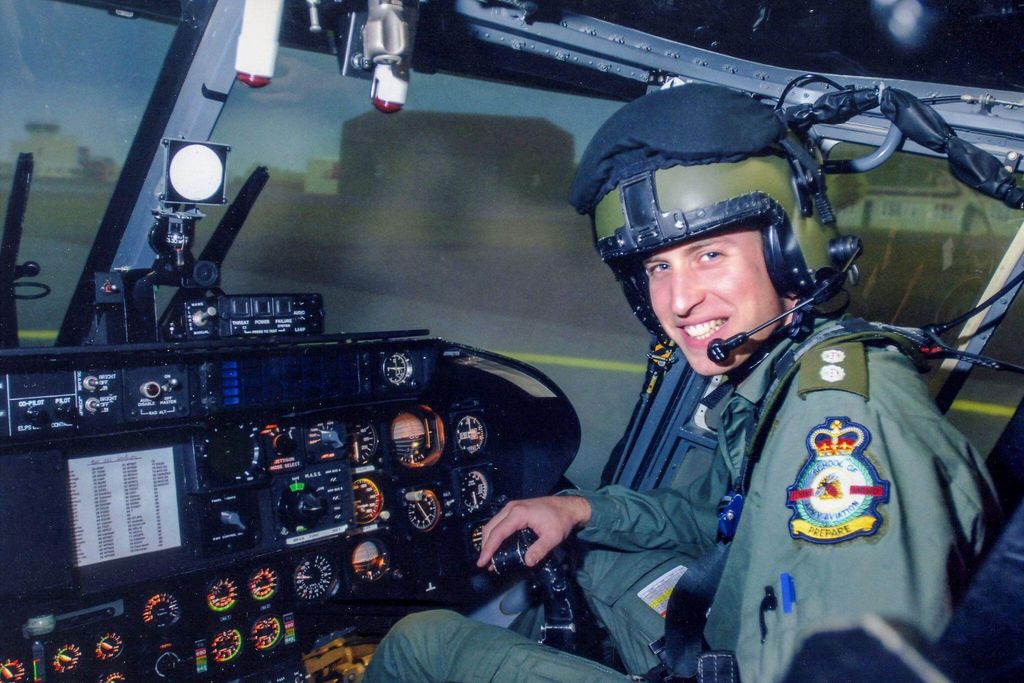 Prince of Wales on the flight deck of a helicopter during a visit to the Army Air Corps