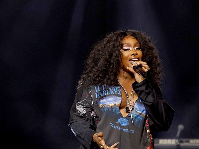 SZA sings on stage at Spotify music event