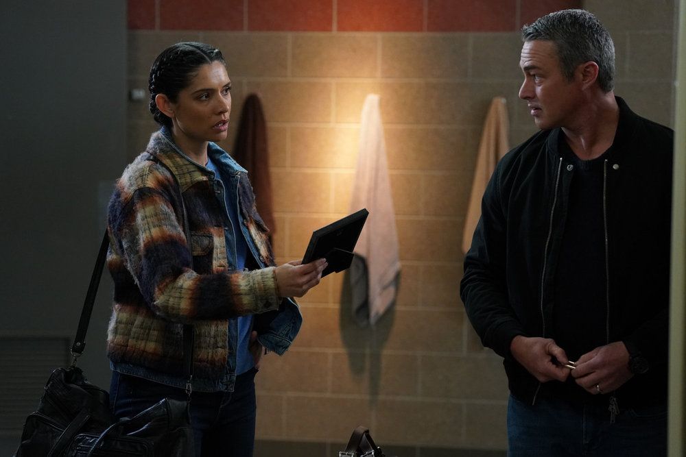 Miranda Rae Mayo as Stella Kidd, Taylor Kinney as Kelly Severide in Chicago Fire