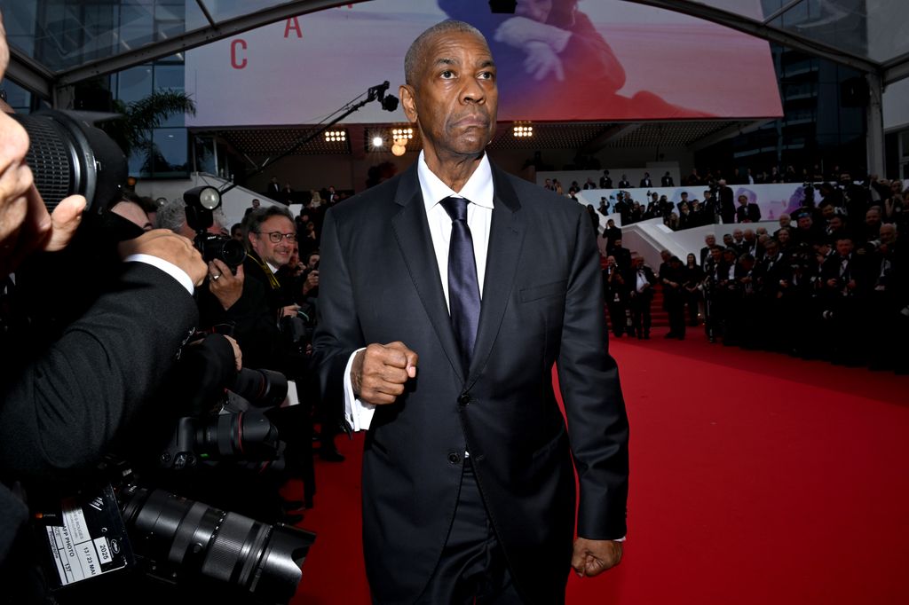 denzel washington on cannes red carpet looking unhappy