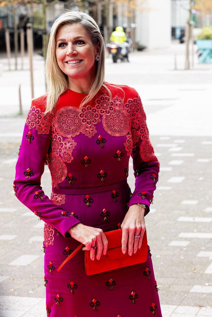 Queen Maxima in purple and red patterned dress