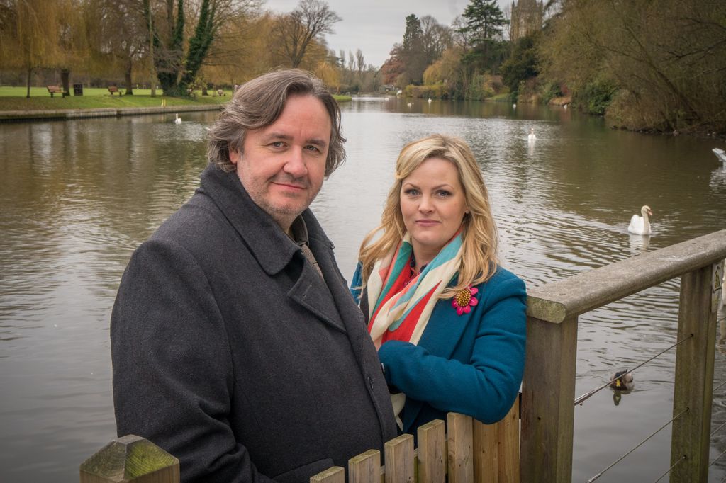 man and woman standing by river. Frank Hathaway (Mark Benton) and Lu Shakespeare (Jo Joyner)