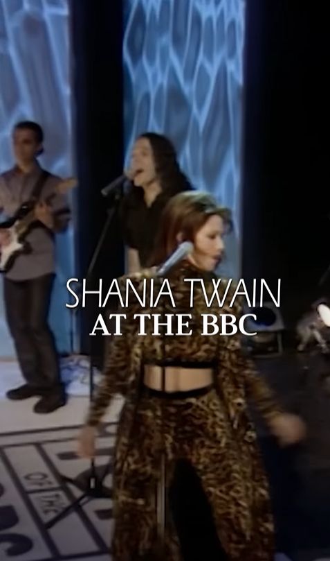 Shania Twain performing in leopard-print