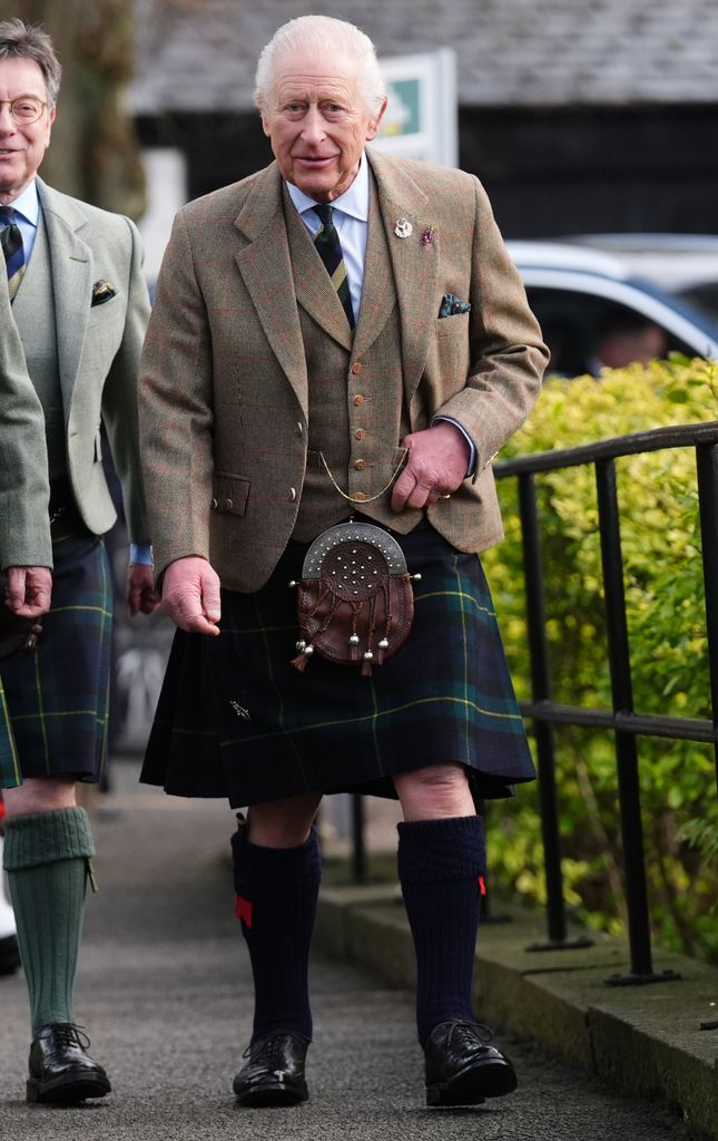 King Charles walking in a kilt