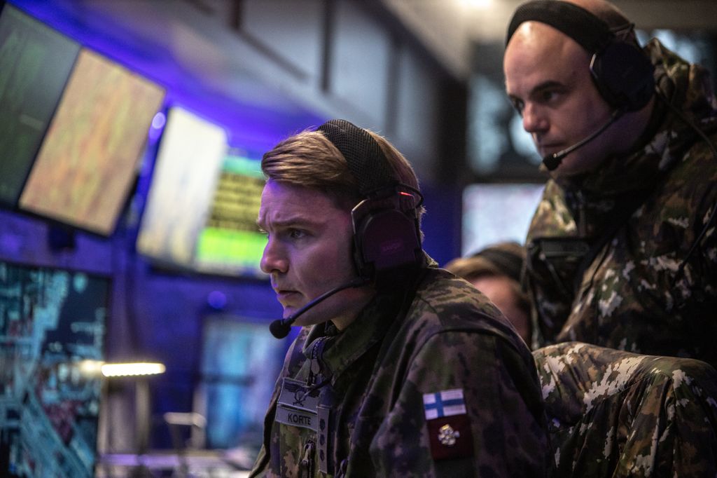 two security men in gallery with computers